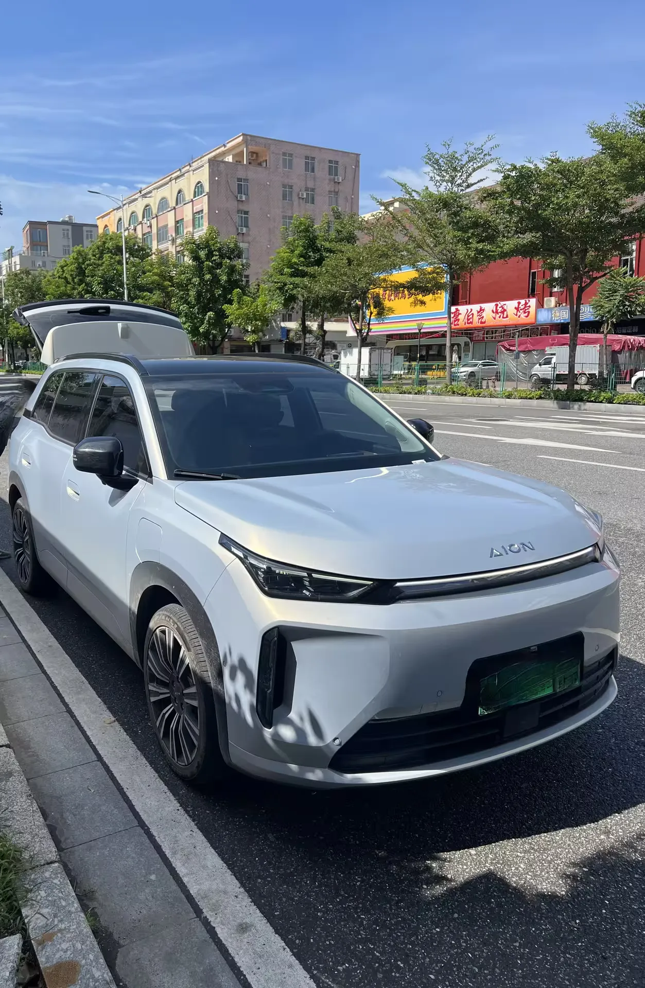 The white AION electric SUV that picked us up outside Yangjiang station