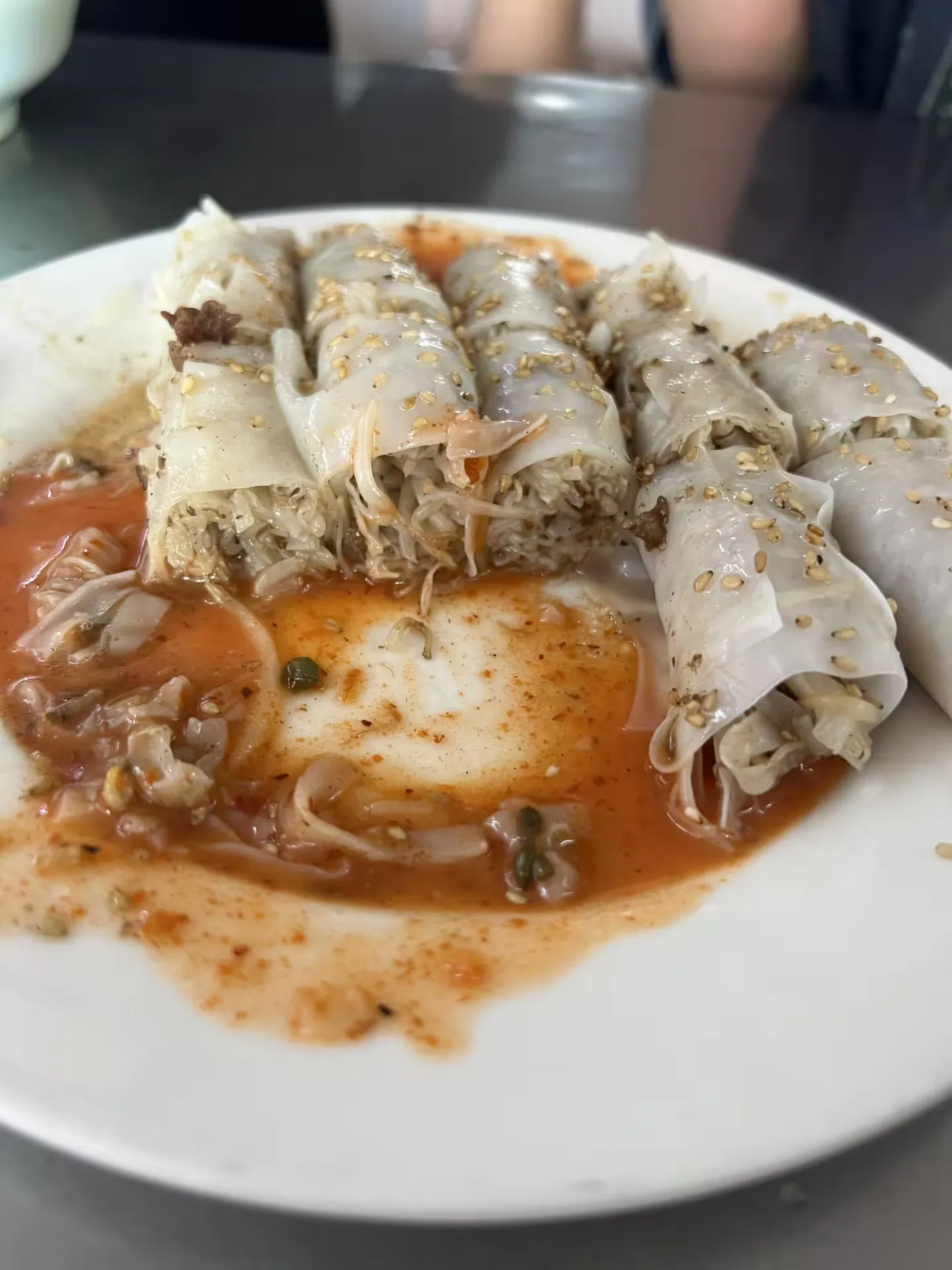 A cross section of Yangjiang cheung fun filled with bean sprouts