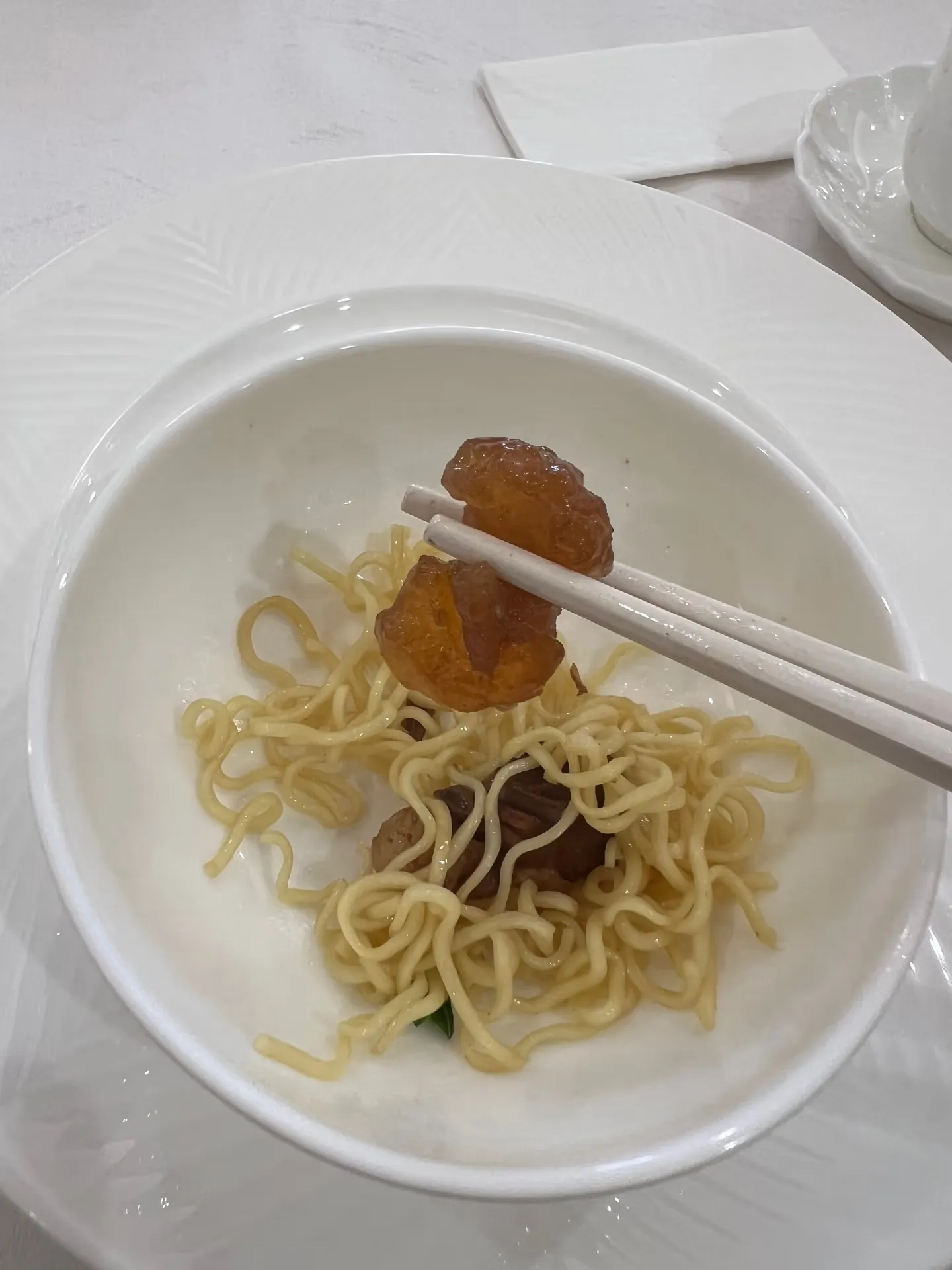 A chewy piece of meat served with the noodles