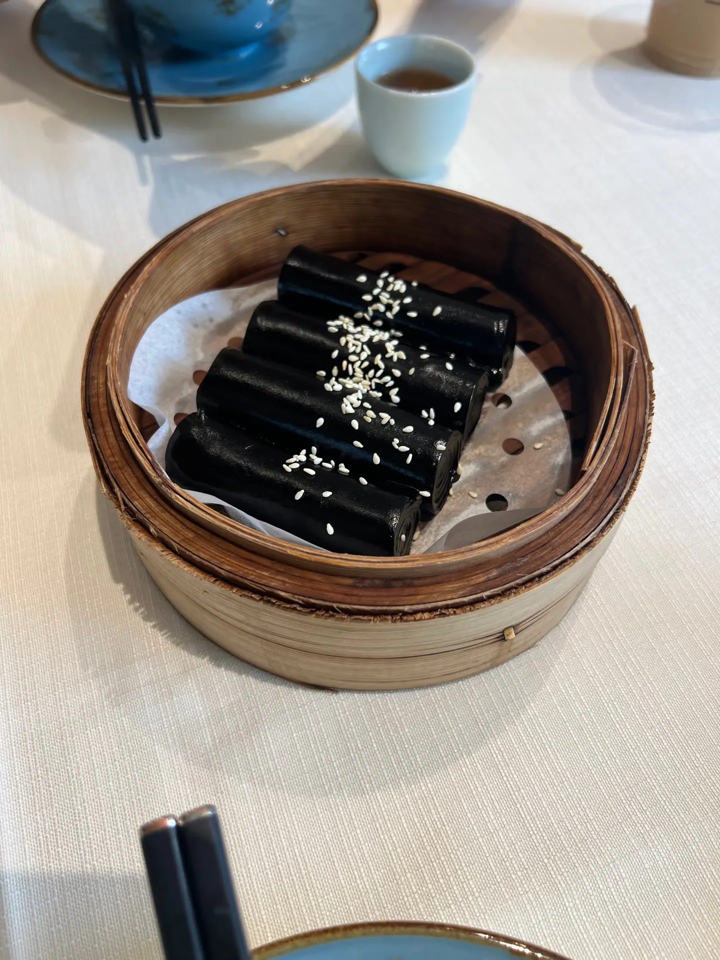 A black cake with a subtle herbal aroma