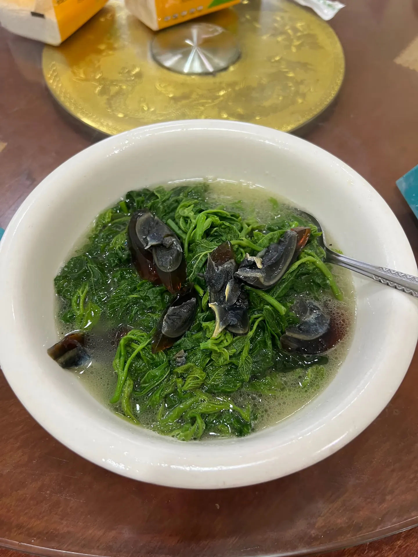 Soup with vegetables and century egg