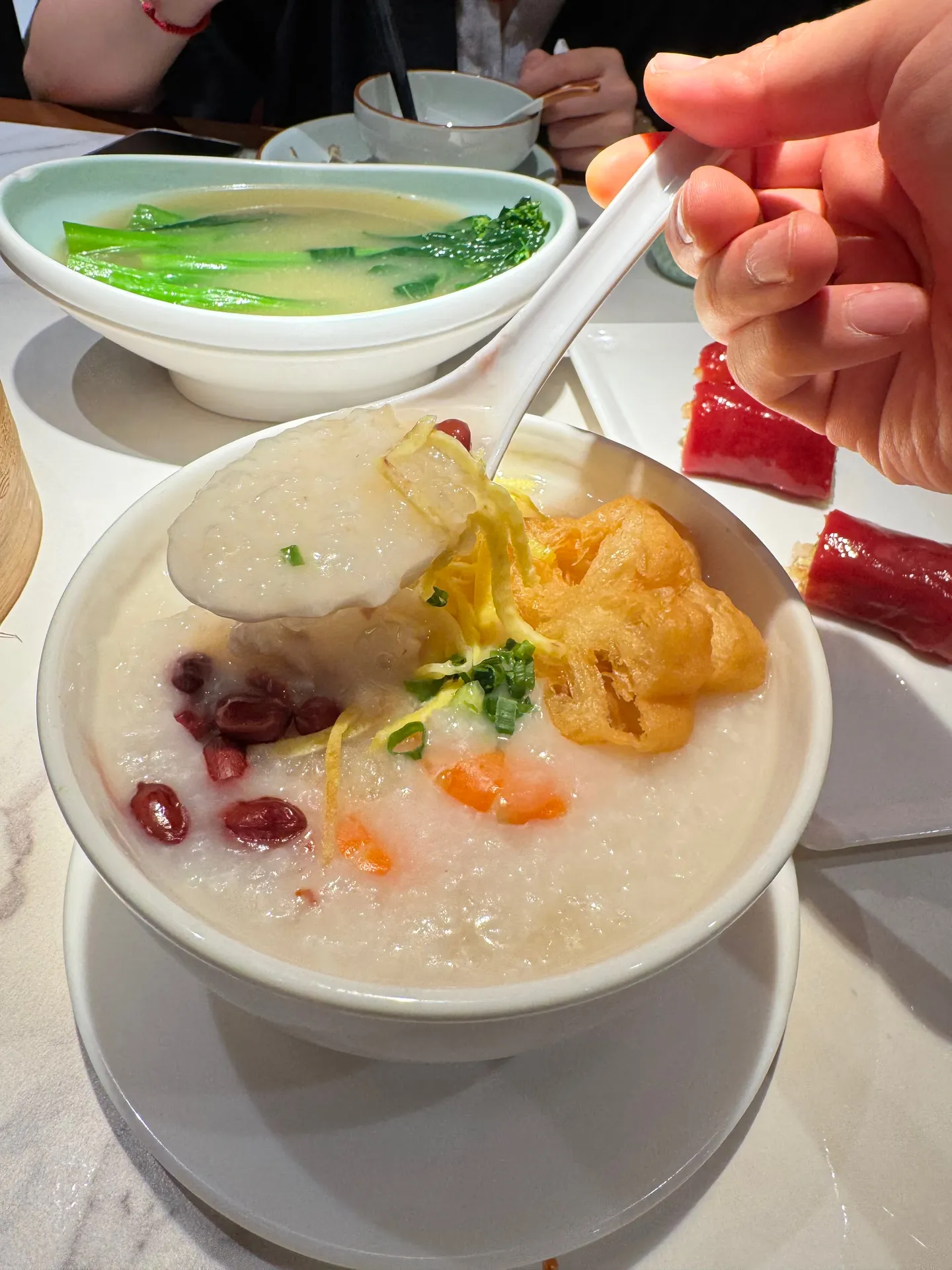 Warm congee with assorted toppings