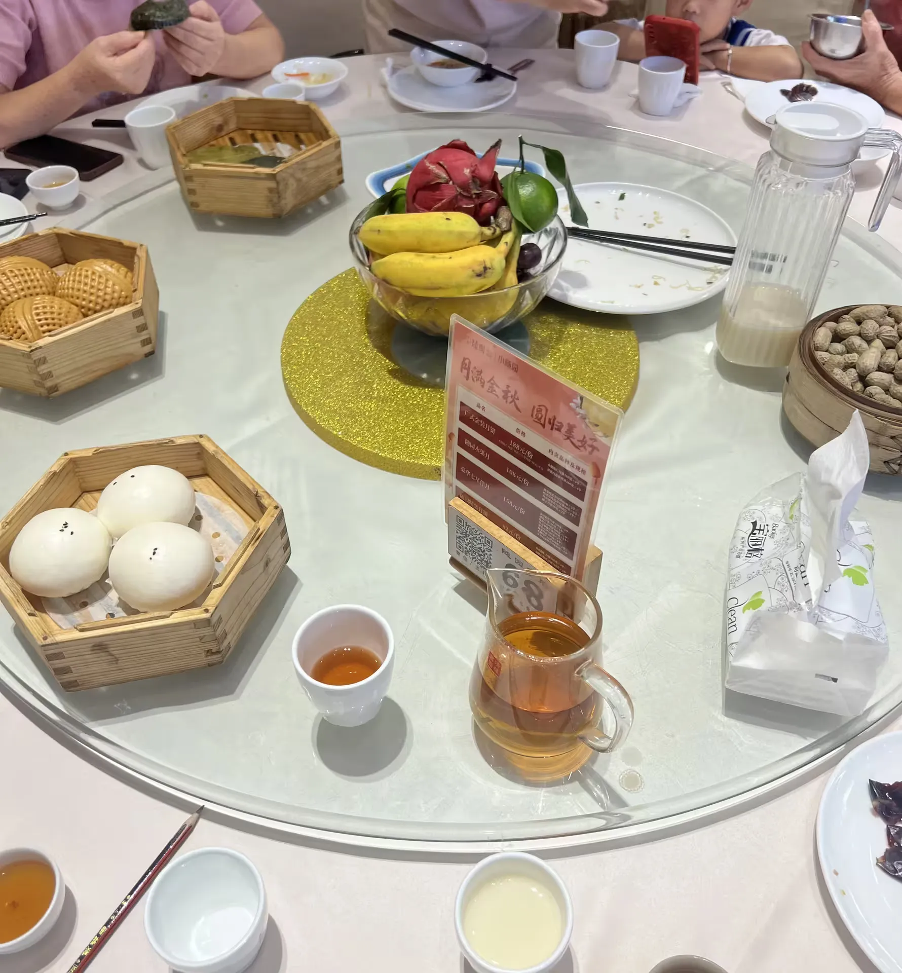 Steamed buns, dim sum and tea arriving at the breakfast table