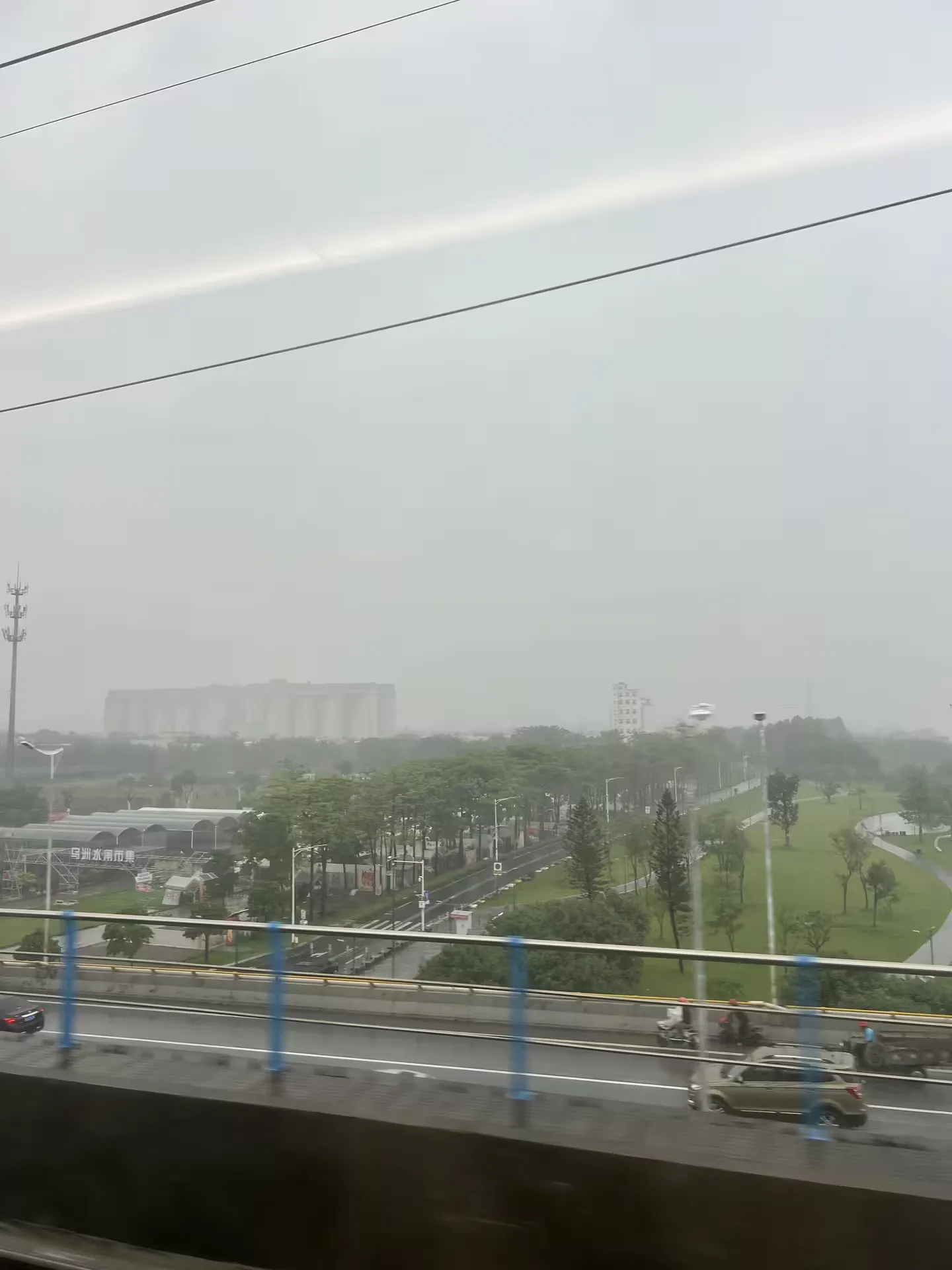 Rainy green countryside in Guangdong through the train window