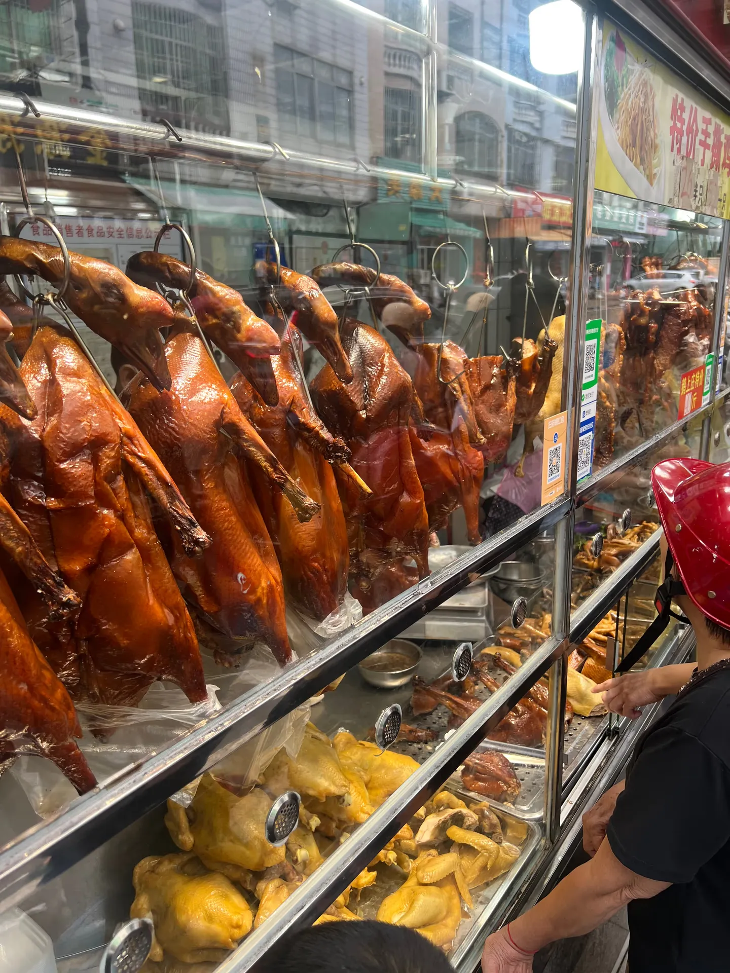 Roast meat behind a glass display