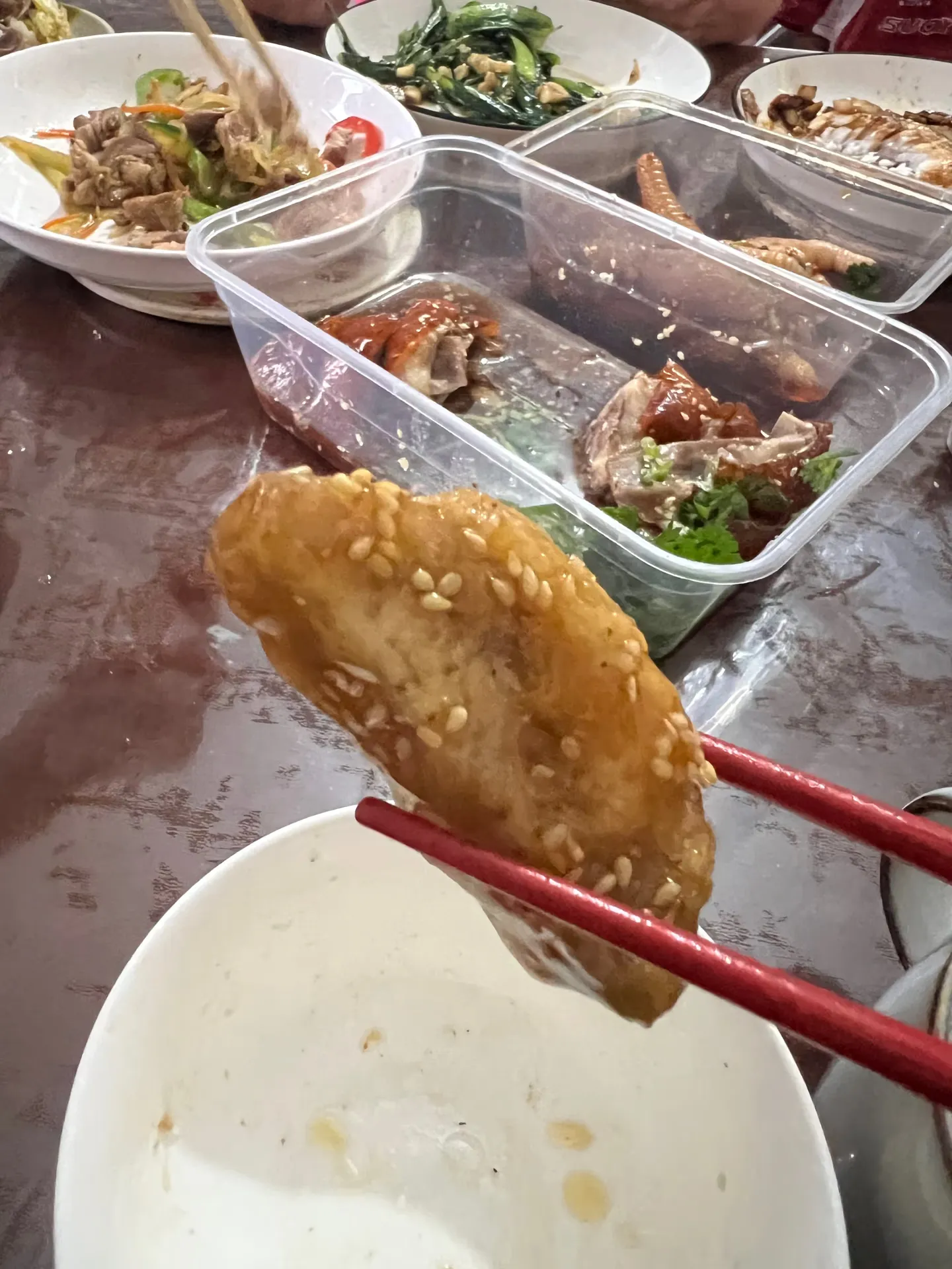 A bite of food picked up with chopsticks
