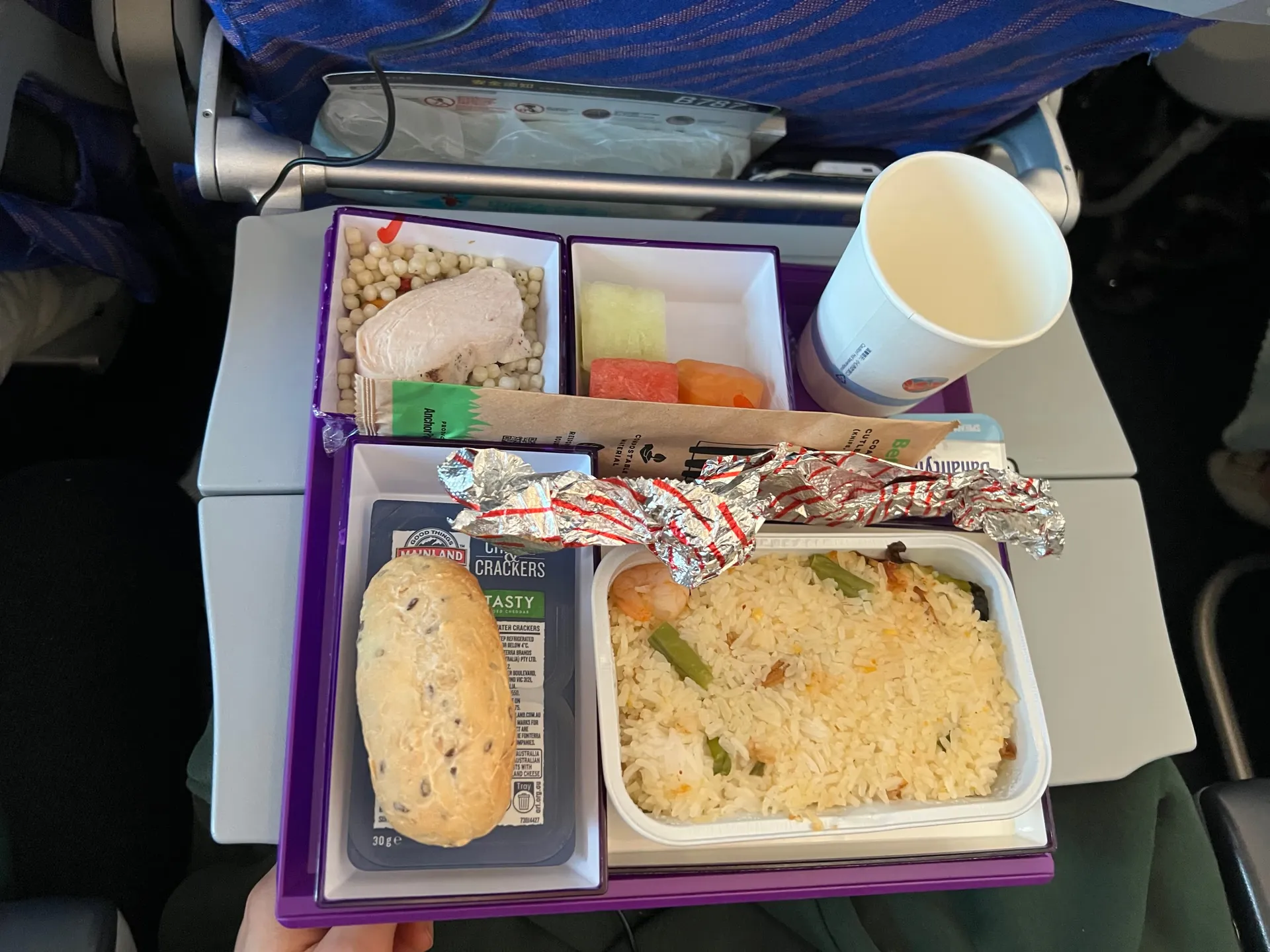 The second inflight meal with rice, bread and fruit