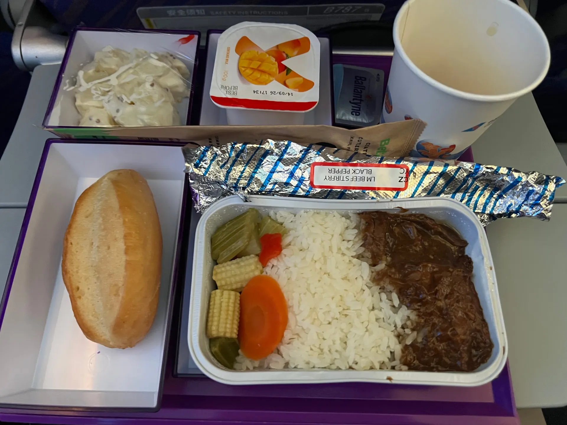 The third inflight meal with rice, vegetables and bread