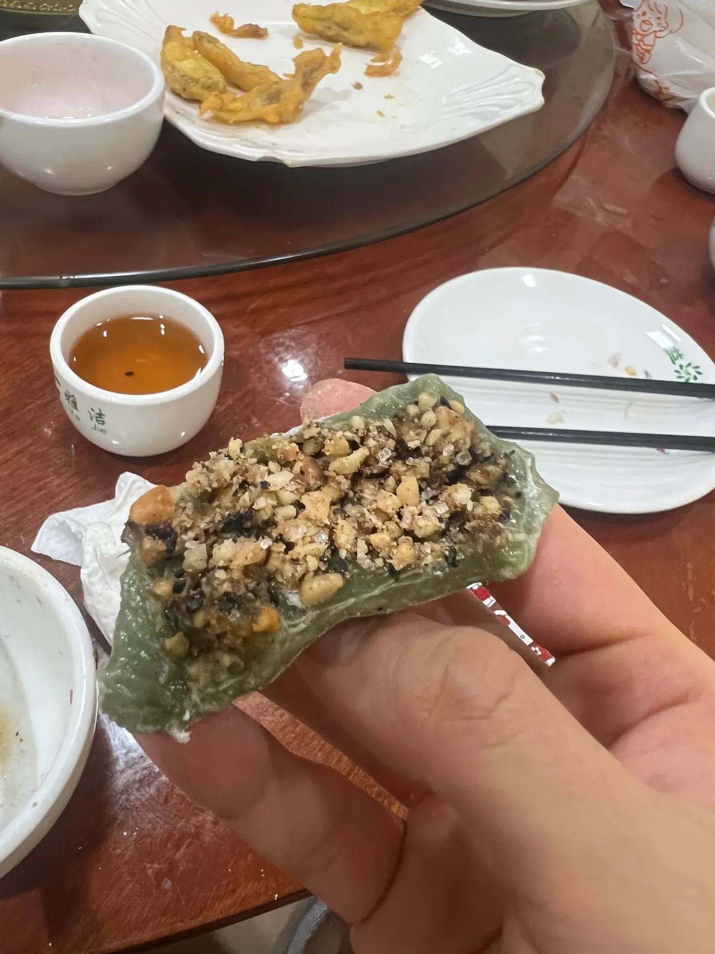 The inside of a cake studded with nuts and seeds