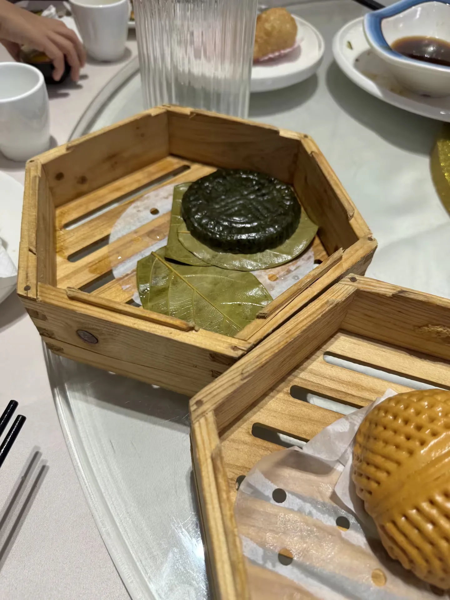 Dark green dim sum steamed on a leaf